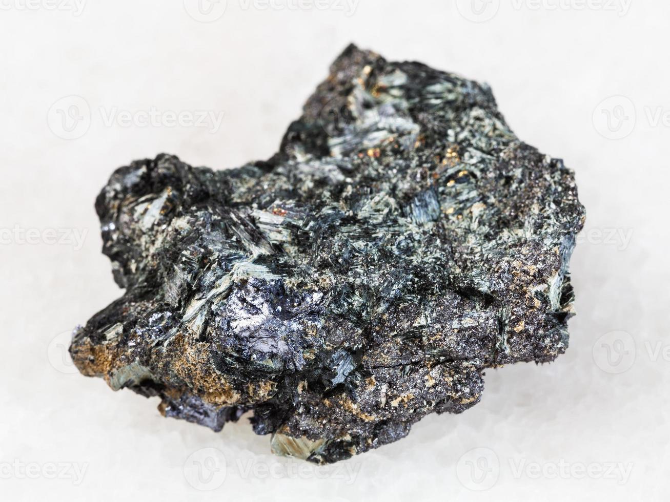 Molybdenite crystal in Glaucophane stone on white photo