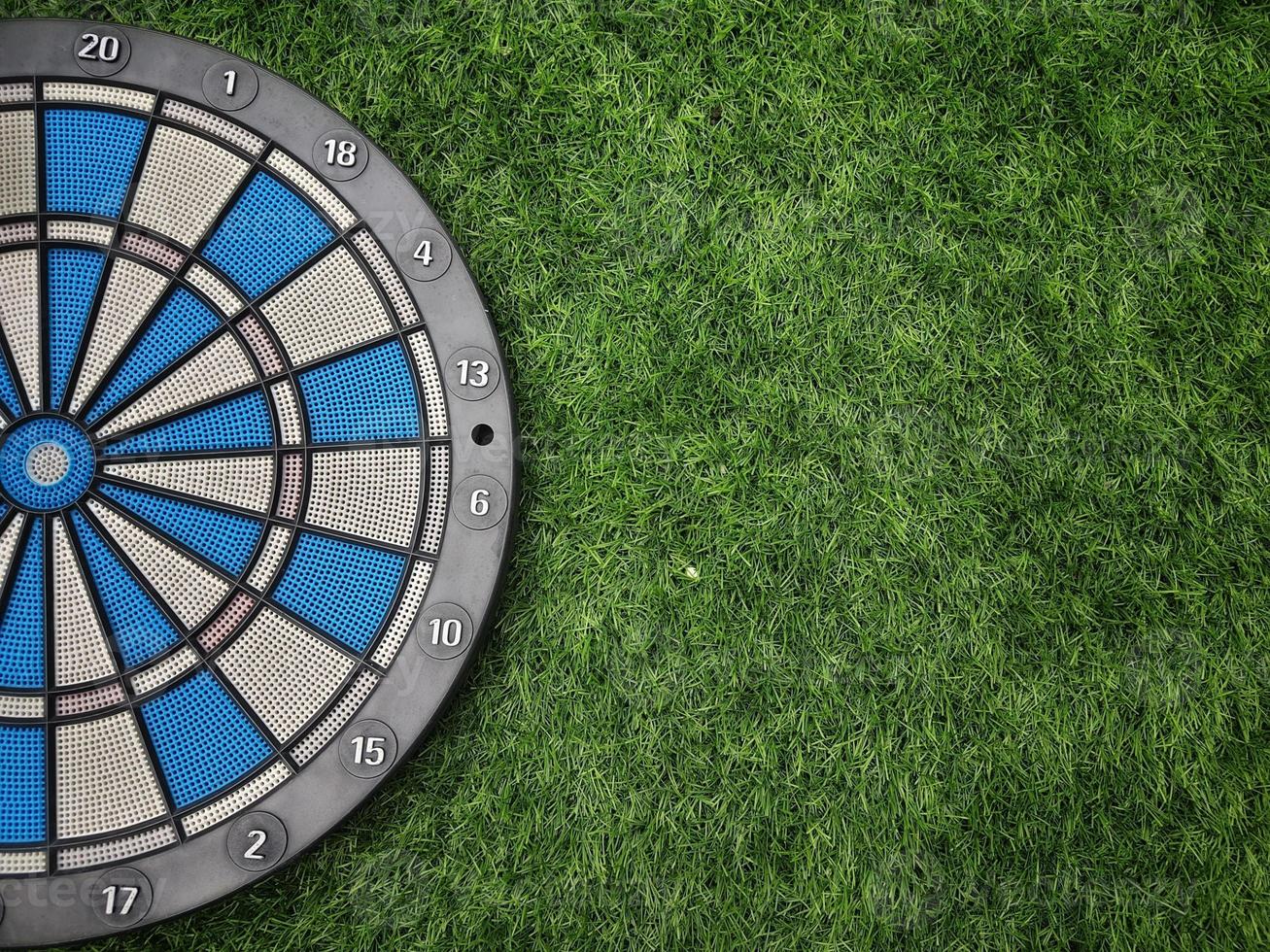 Dart with grass green background. photo