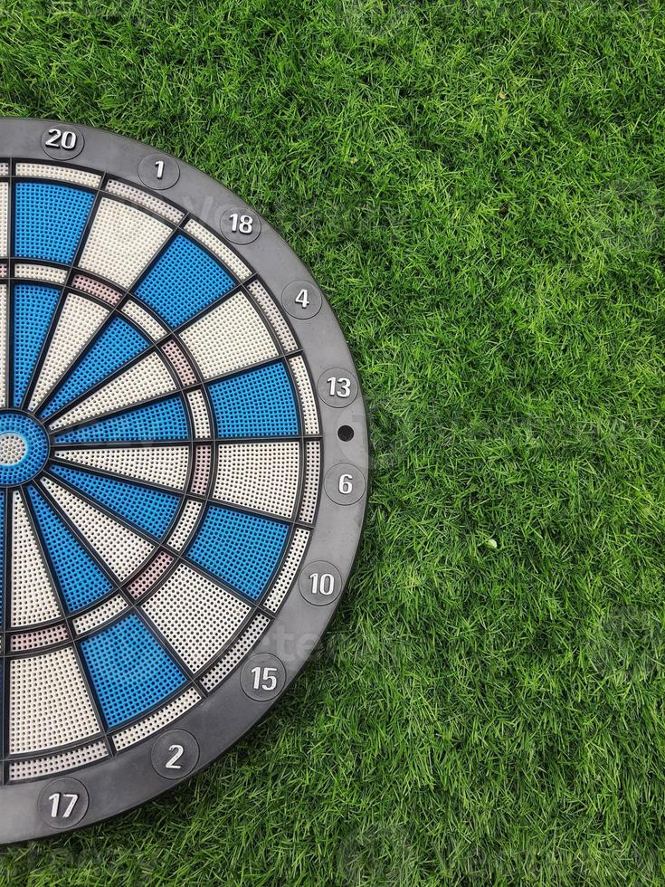 Dart with grass green background. photo