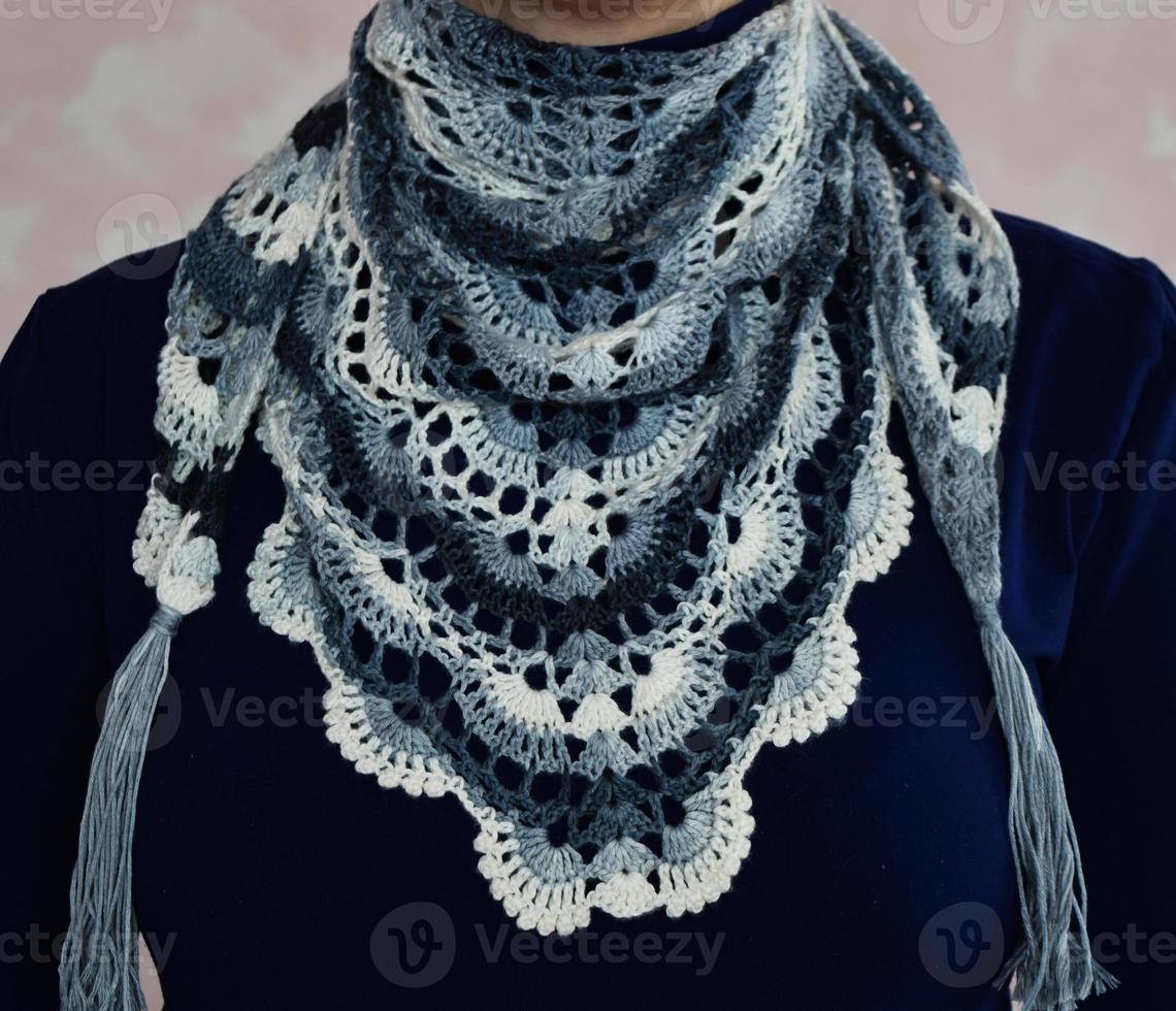 Woman in lace crochet. Woman with colorful shawl. Knitted white-blue handkerchief for girl. photo