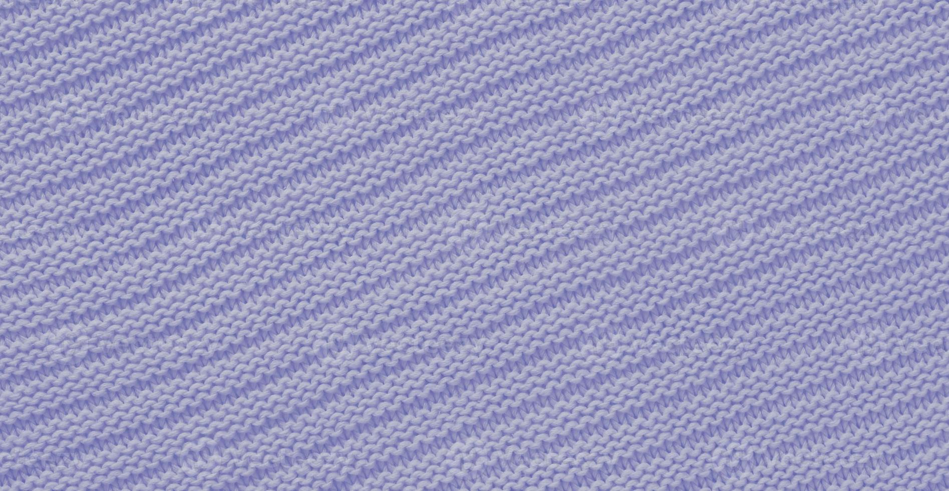 Texture of smooth knitted sweater with pattern. Handmade knitting wool or cotton fabric texture. Background of knitting patterns with horizontal stripes. photo