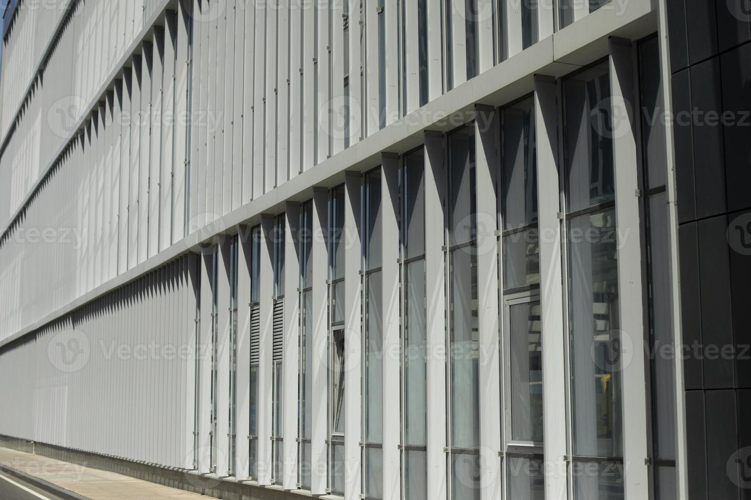 Building is outside. Windows in building. Vertical lines in architecture. photo