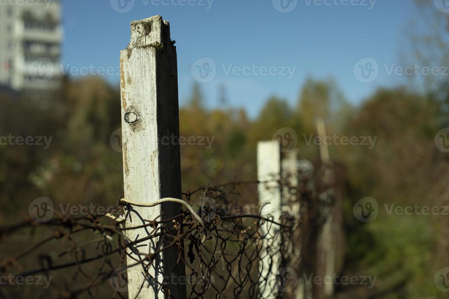 Fence in detail. Fence around house. Barrier for outsiders. photo