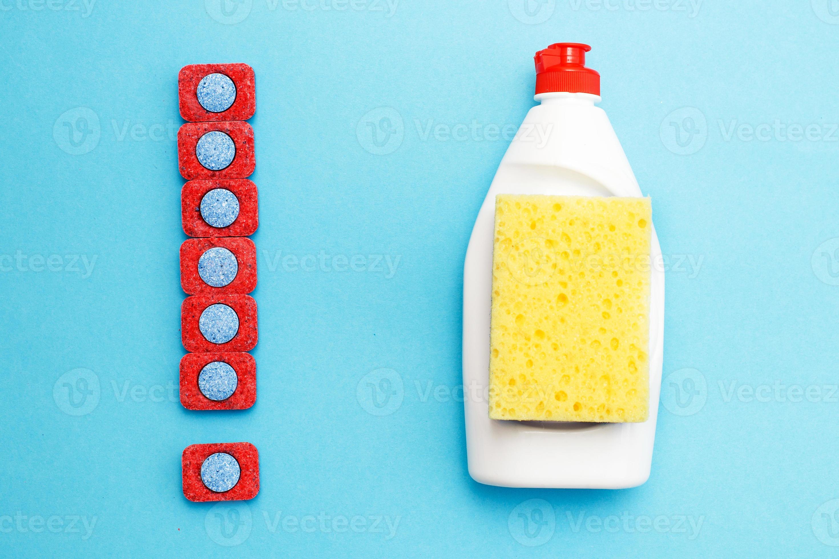 capsules for dishwashers, dishwashing liquid and sponges on a blue