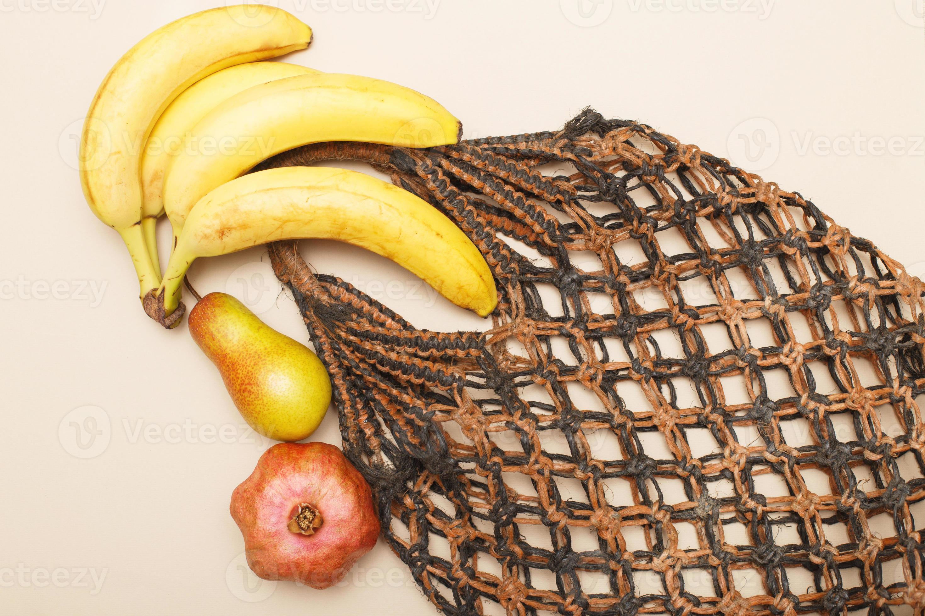 brown string bag with ripe fruits on a beige background 13933861 Stock  Photo at Vecteezy