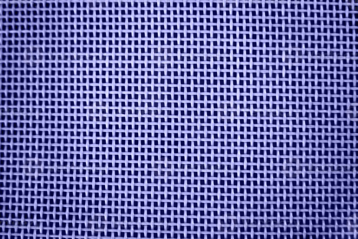 Weaving or mesh pattern background. purple plastic texture photo