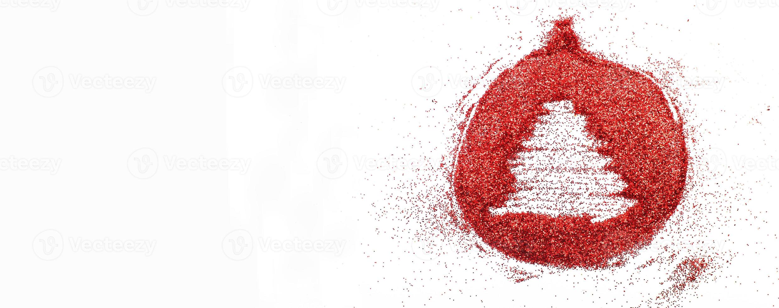 finger drawn tree on shiny red confetti background. christmas toy ball. banner photo