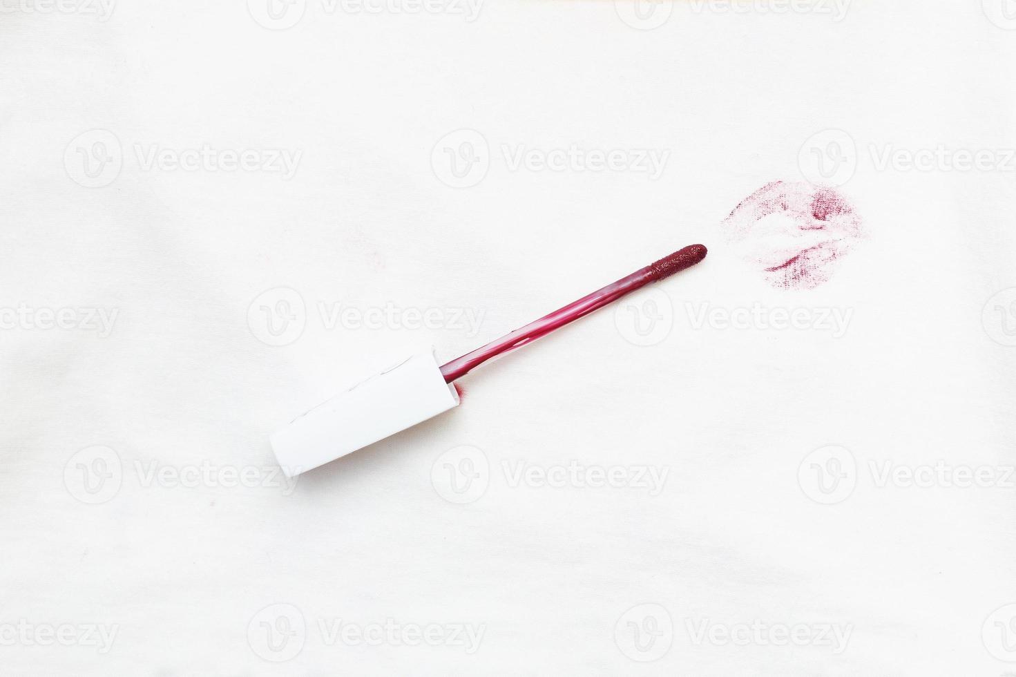 red lipstick on a white clothes with dirty stain from kiss photo