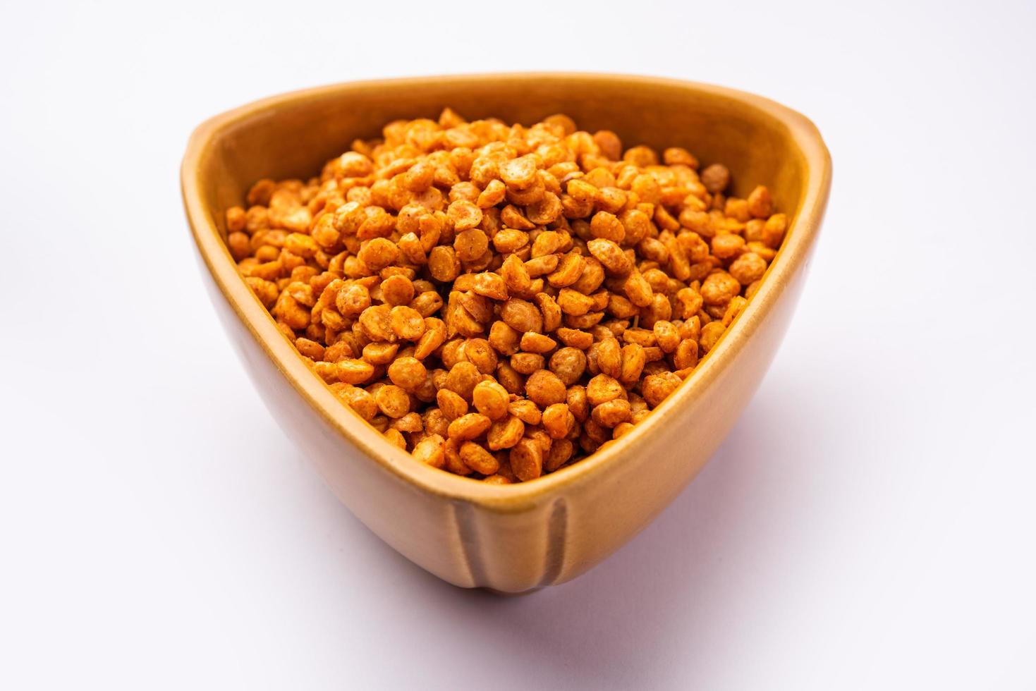 Fried and Spicy Chana Dal Masala namkeen is a popular Chakna recipe. served in a bowl photo