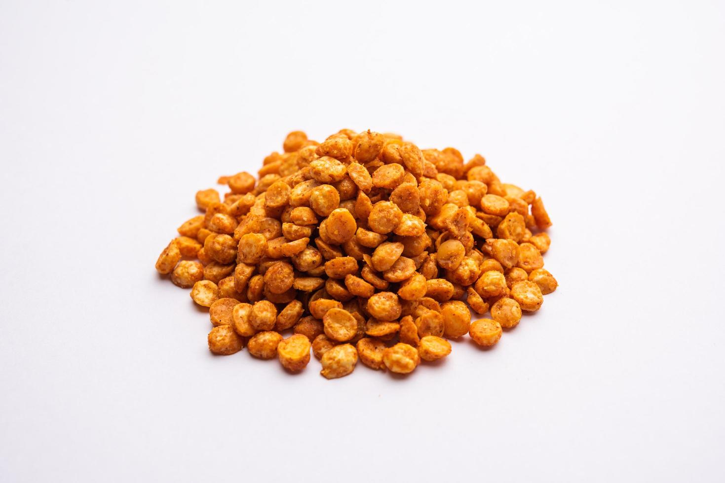 Fried and Spicy Chana Dal Masala namkeen is a popular Chakna recipe. served in a bowl photo