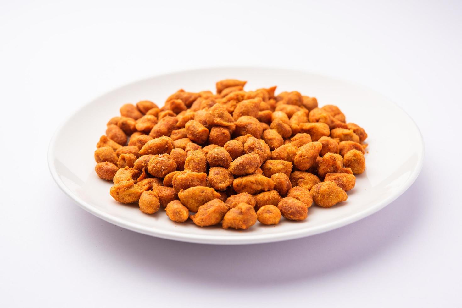 Masala Peanuts are spicy and crunchy snack coated in chickpea flour, Indian snack photo