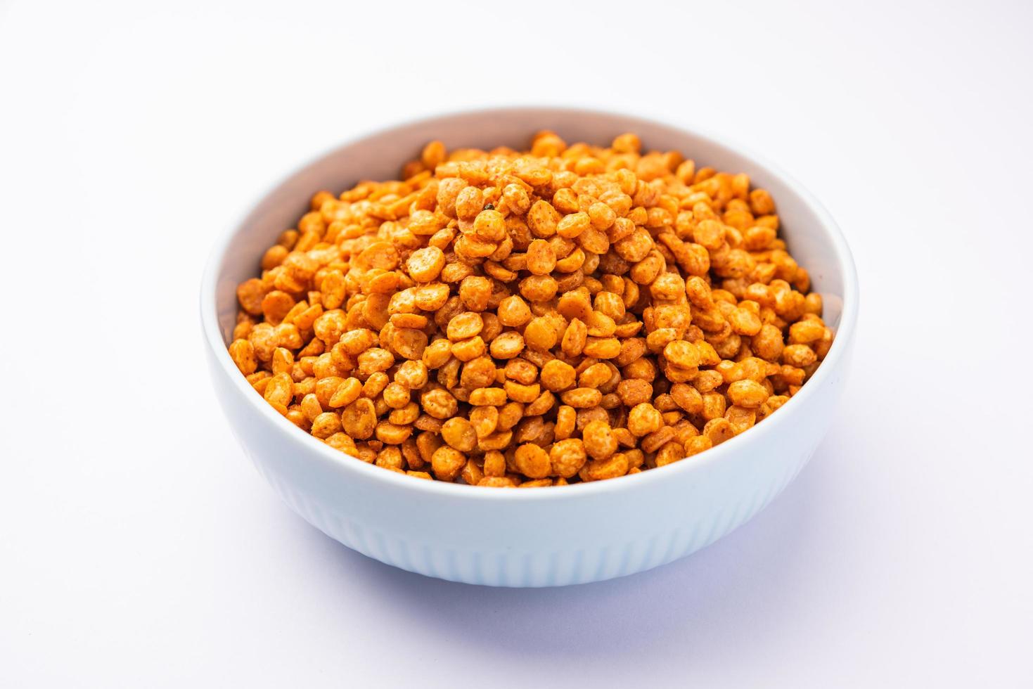 Fried and Spicy Chana Dal Masala namkeen is a popular Chakna recipe. served in a bowl photo