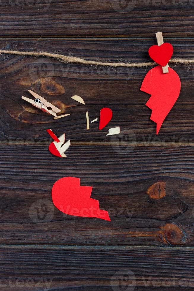 Broken heart breakup collection and divorce icon. Red paper shaped as a torn love , health care problems due to illness. Broken love concept photo