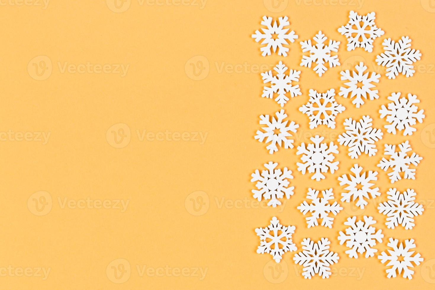 Top view of winter ornament made of white snowflakes on colorful background. Happy New Year concept with copy space photo
