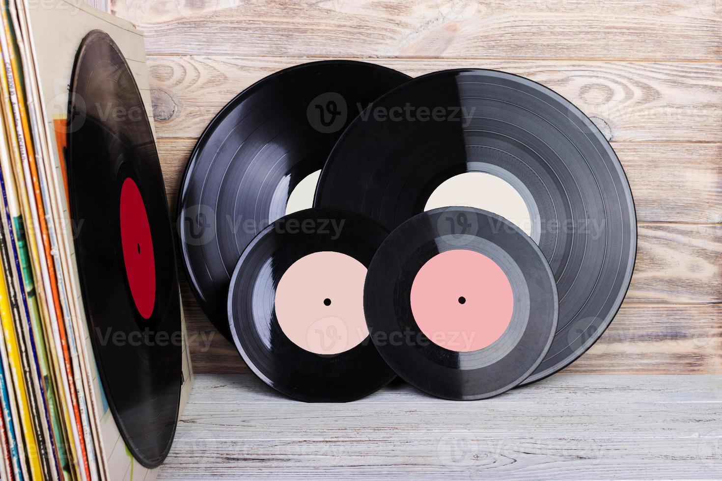 Vinyl record in front of a collection of albums. Copy space for text. photo