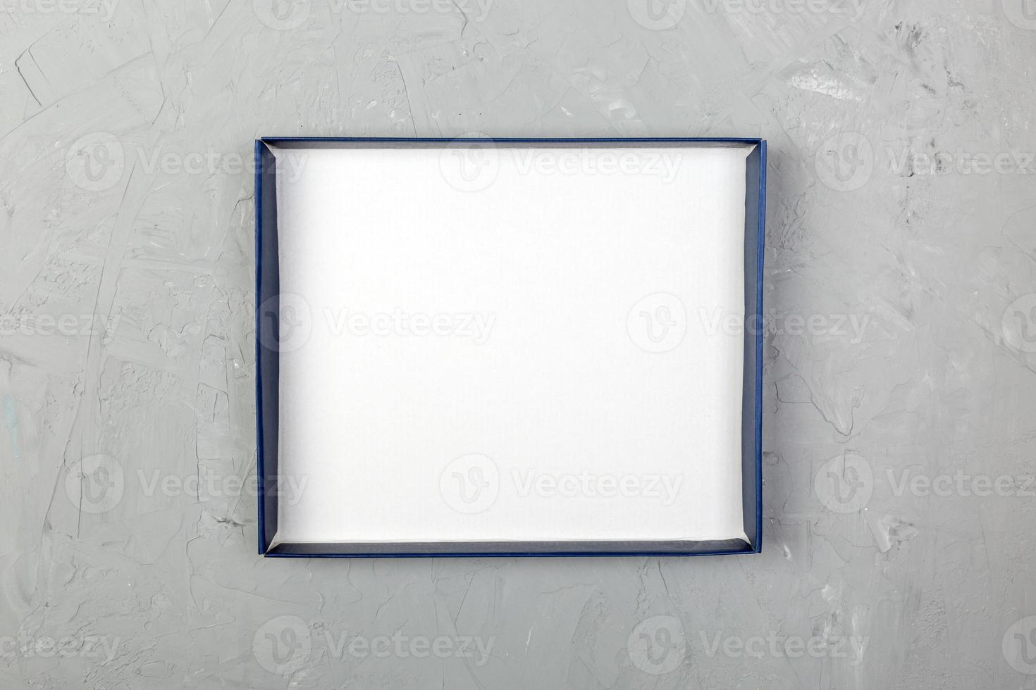 cardboard box on gray cement background surface. top view blank for you design photo
