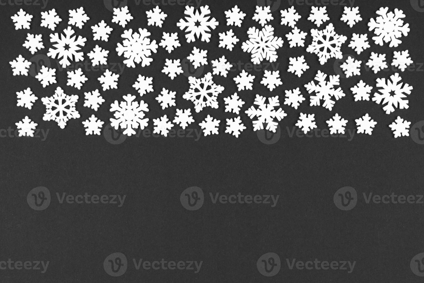 Top view of winter ornament made of white snowflakes on colorful background. Happy New Year concept with copy space photo