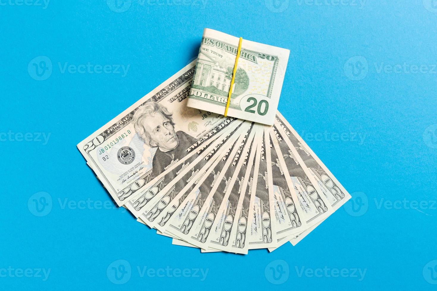 A Hundred dollar currency fan close up, Top view of business concept on colored background with copy space photo