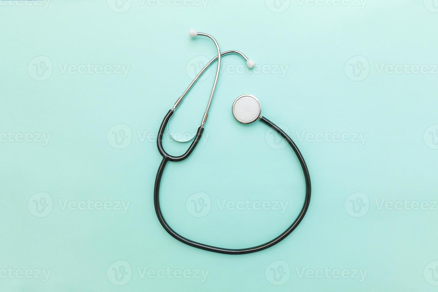 Medicine equipment stethoscope or phonendoscope isolated on trendy pastel blue background. Instrument device for doctor. Health care life insurance concept photo