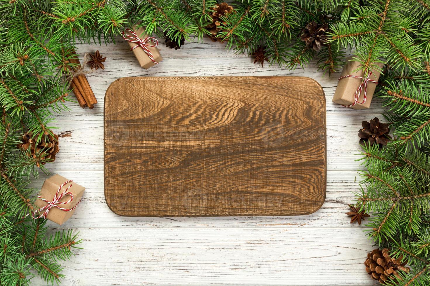 top view. Empty wood rectangular plate on wooden christmas background. holiday dinner dish concept with new year decor photo