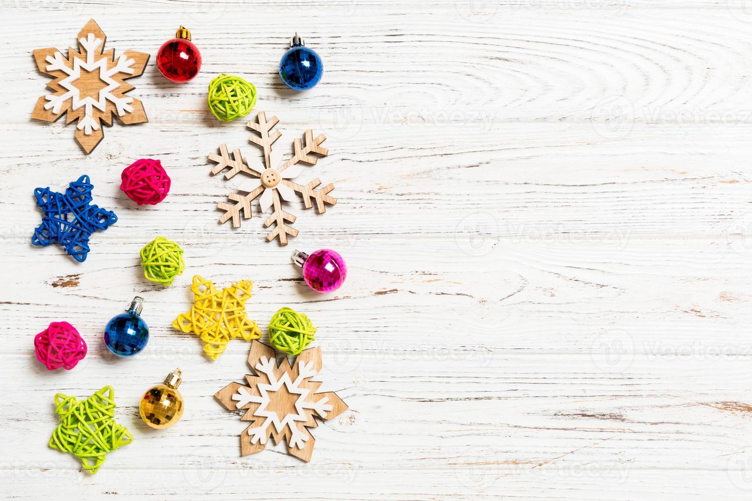 Top view of Christmas decorations and toys on wooden background. Copy space. Empty place for your design. New Year concept photo