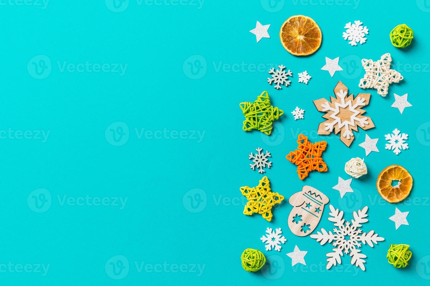 Top view of blue background with New Year toys and decorations. Christmas time concept with copy space photo