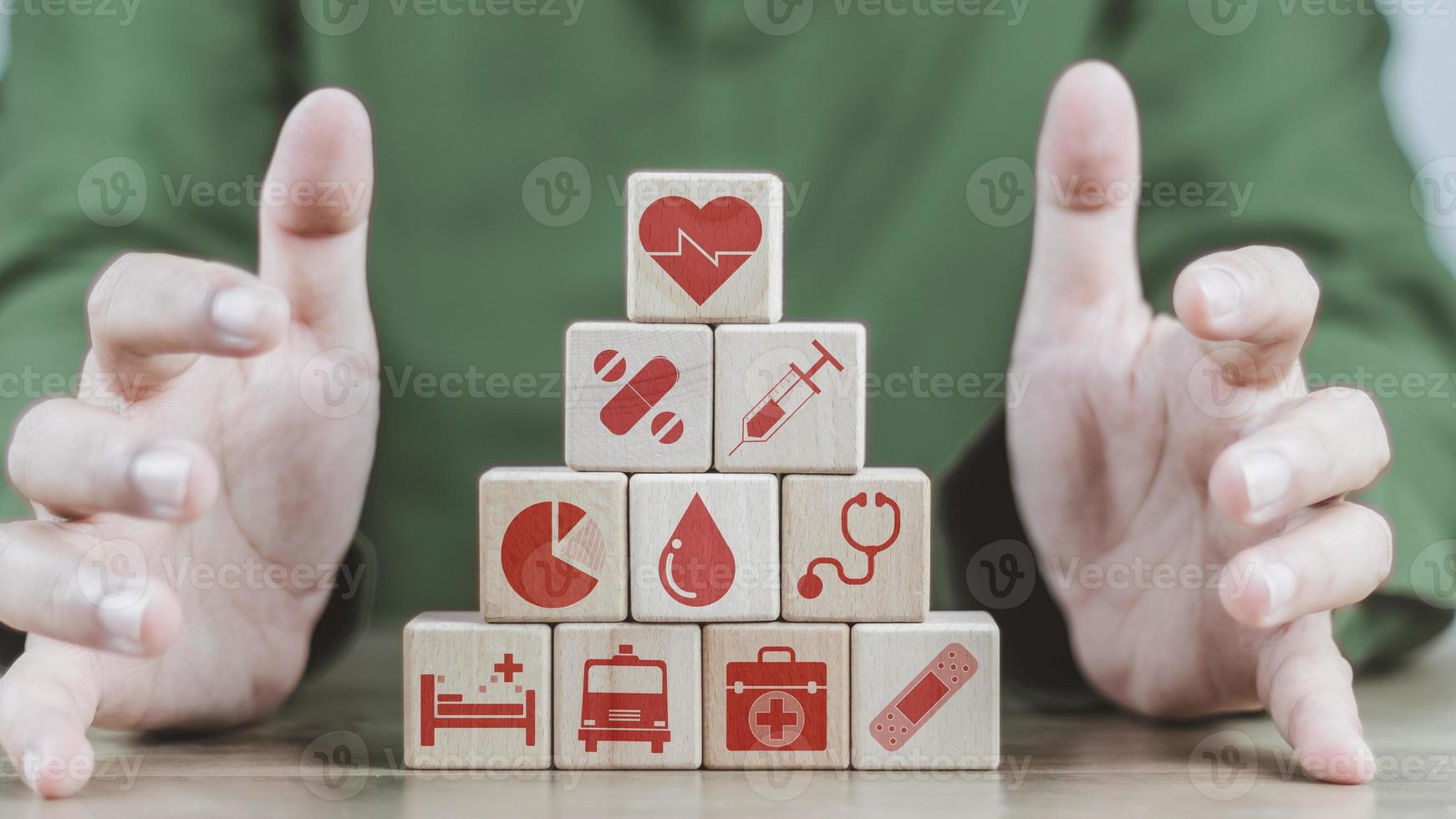 insurance concept, a man's hand is building a cube wood to show the decision about life insurance to plan the future for themselves and their families on money, health and tax breaks. photo