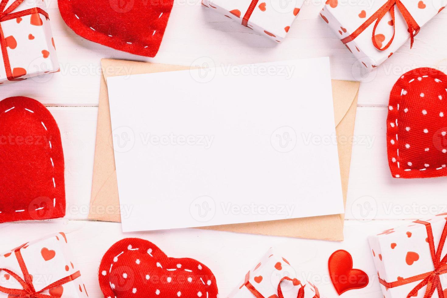 Envelope Mail with Red Heart and gift box over White Wooden Background. Valentine Day Card, Love or Wedding Greeting Concept photo