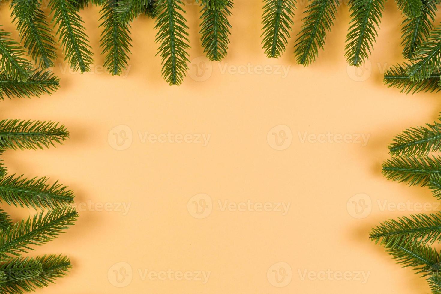 Top view of colorful festive background made of fir tree branch. Christmas holiday concept with copy space photo