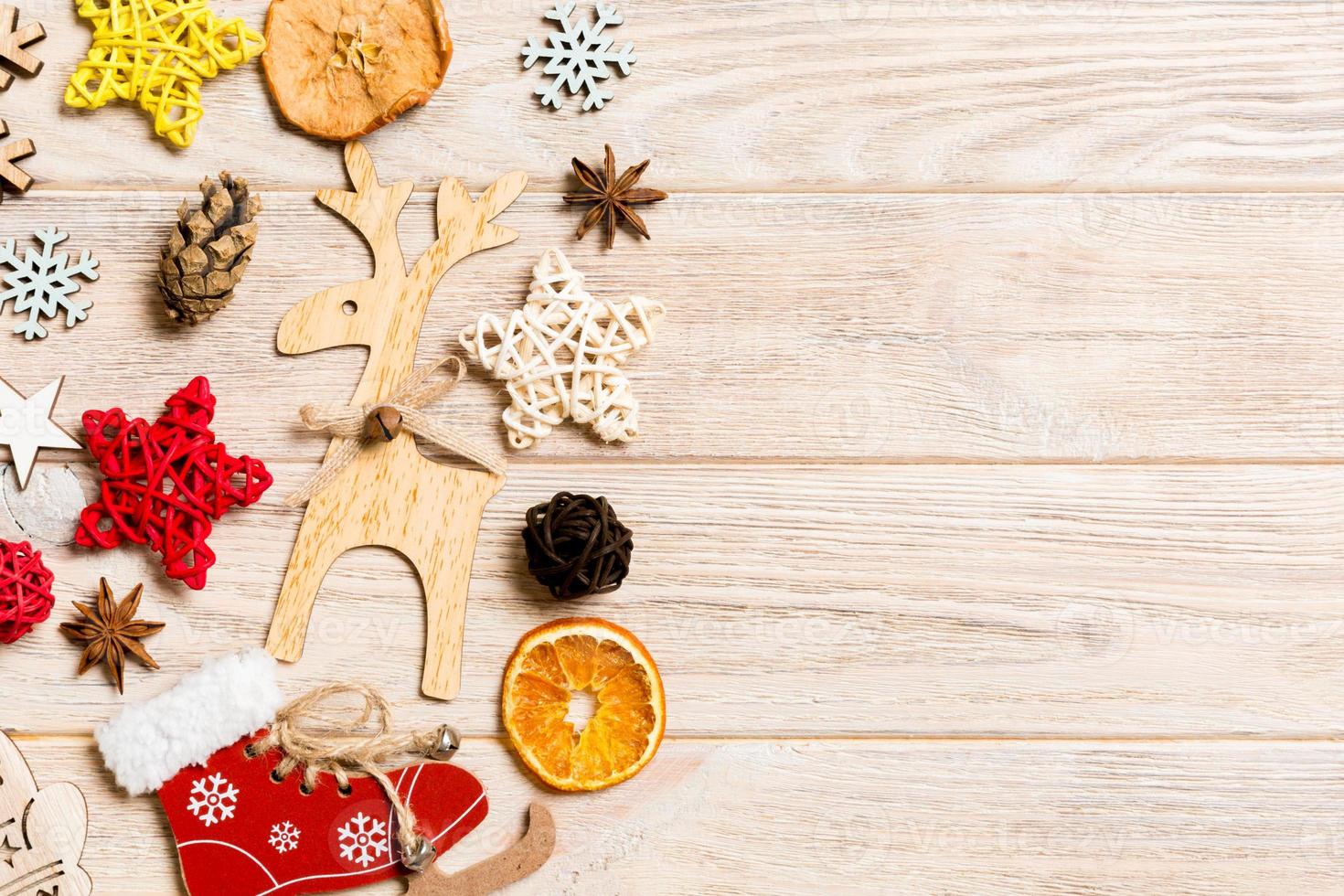 Top view of Christmas decorations and toys on wooden background. Copy space. Empty place for your design. New Year concept photo