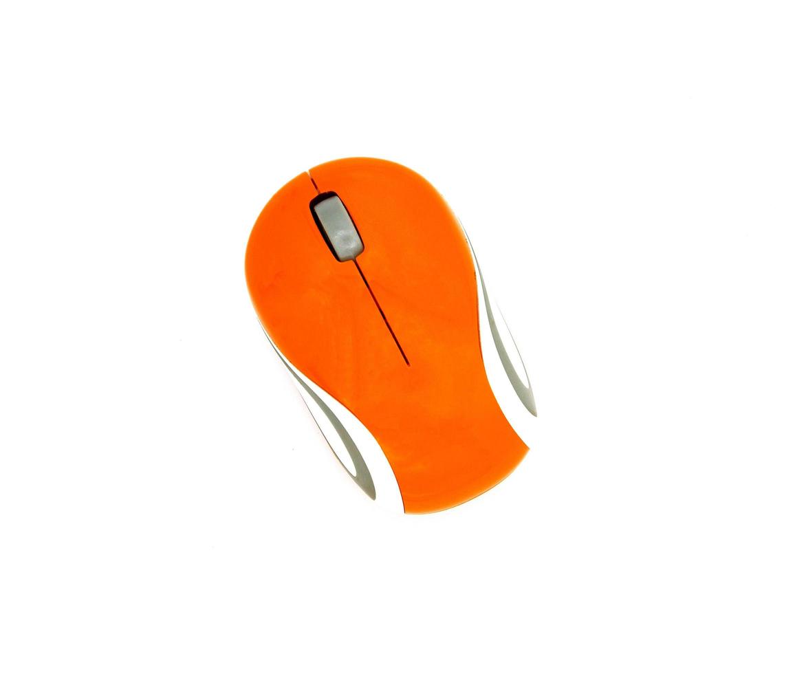 Top view of used orange and white wireless or Bluetooth computer mouse isolated on white background with clipping path or make selection. Technology, Flat lay of Electronic device and gadget. photo