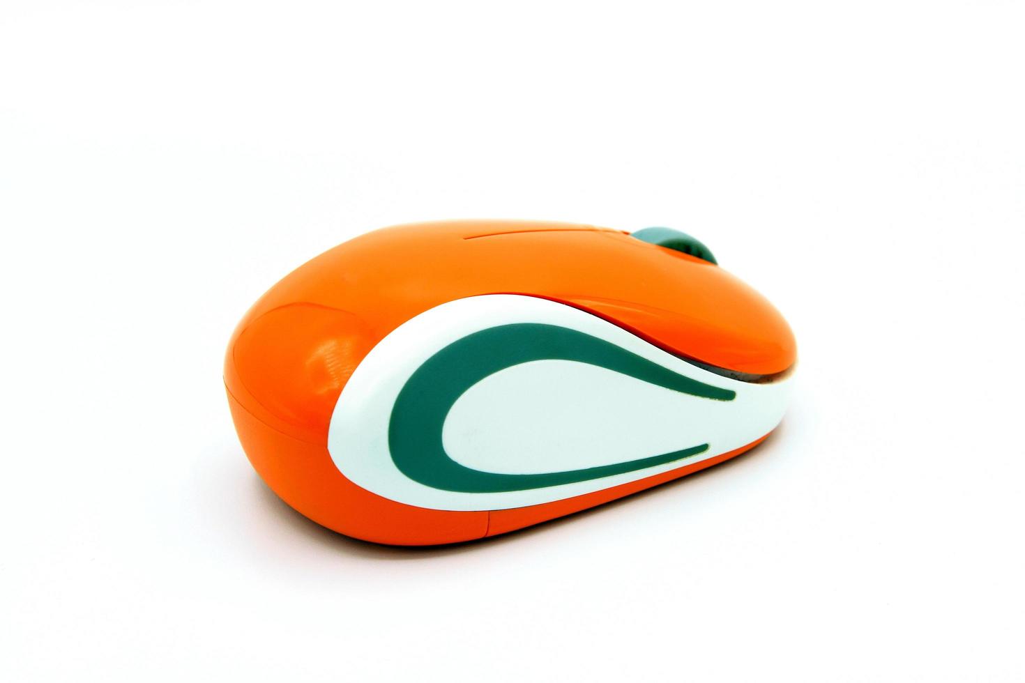 Close up used orange and white wireless or Bluetooth computer mouse isolated on white background with clipping path or make selection. Technology, Electronic device and gadget. photo