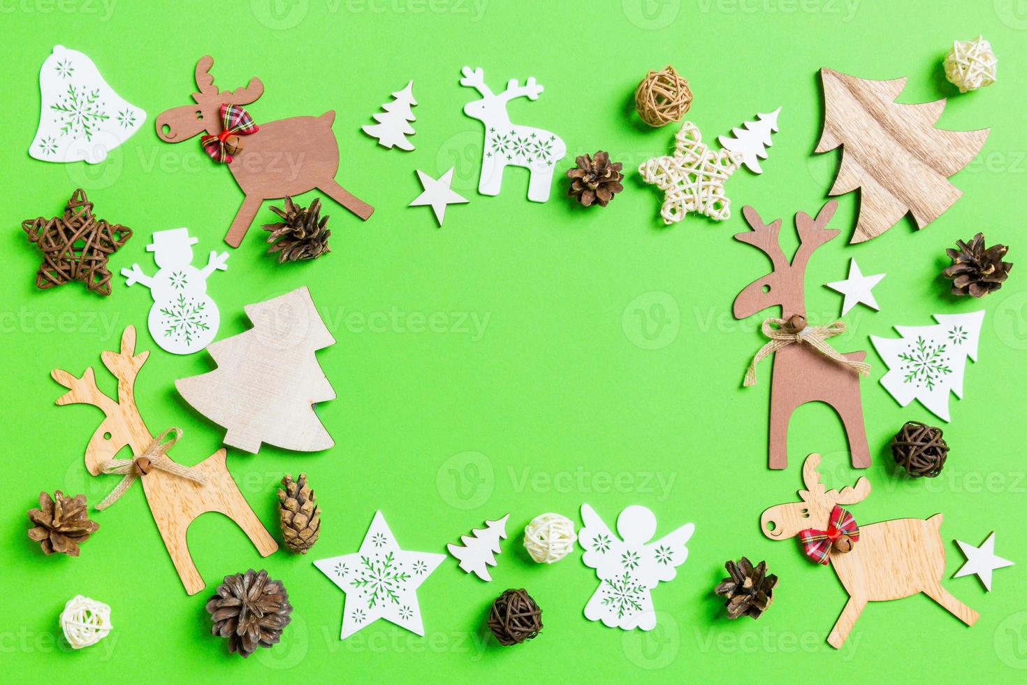 Christmas green background with holiday toys and decorations. Happy New Year concept with empty space for your design photo