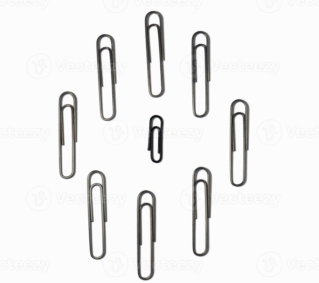 Large paper clips on a white background. Office supplies isolate. Paper fastening.  Goods for business photo