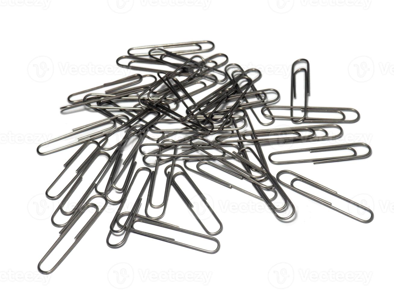 Large paper clips on a white background. Office supplies isolate. Paper fastening. Paper clips. photo