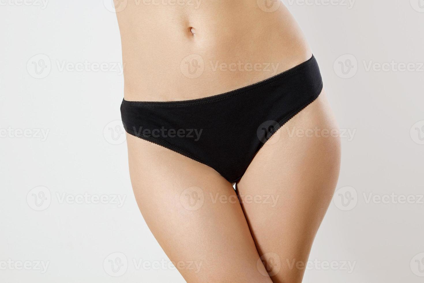 Template Blank Close up Black Woman Panties isolated on white background. Cropped image. Flat Belly and nutrition concept. Female health. Pain periods and cycle problems. Front view and copy space photo