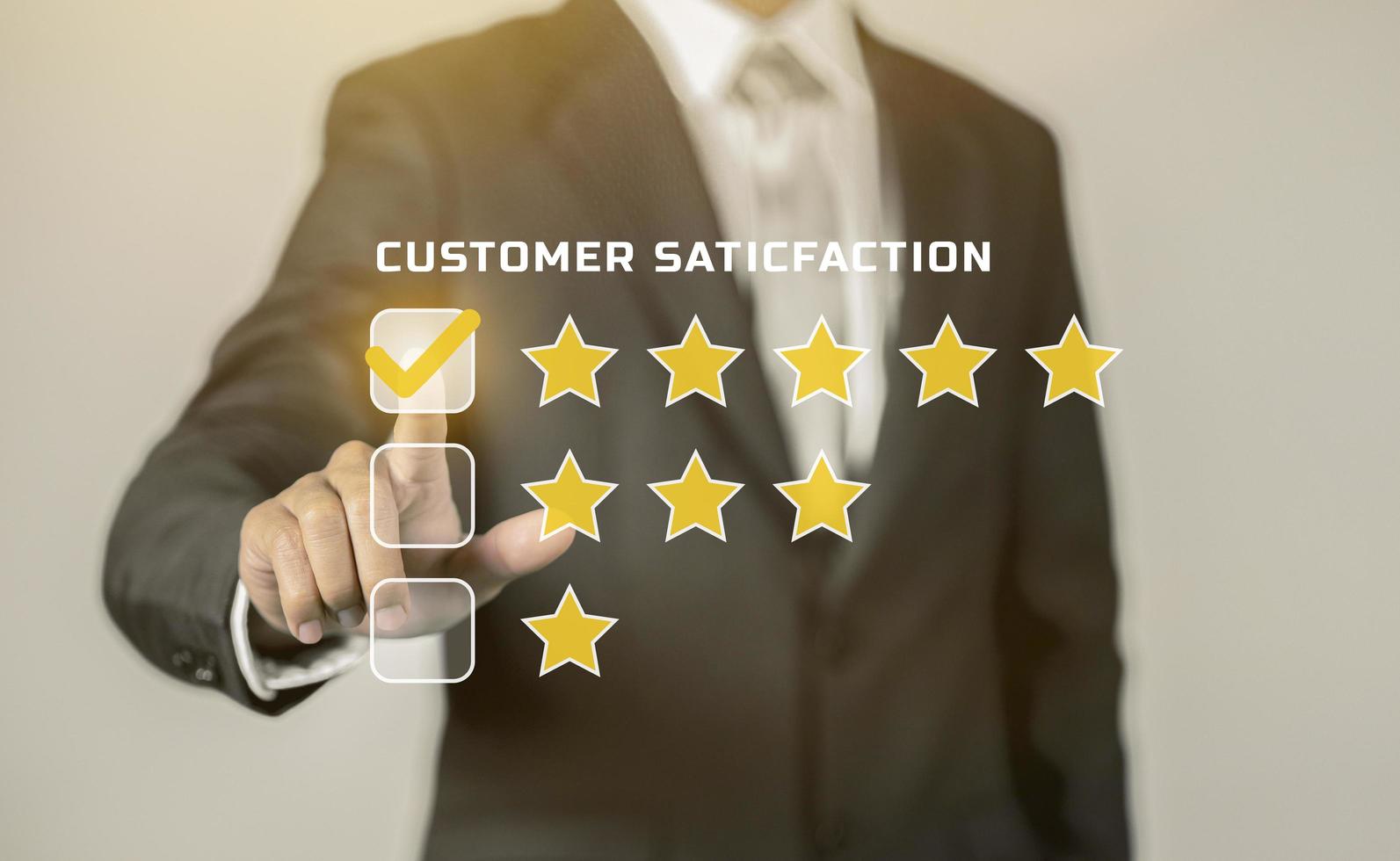 Businessman giving rating with hand touching virtual screen, Customer Experience concept, Customer service and satisfaction feedback concept. photo