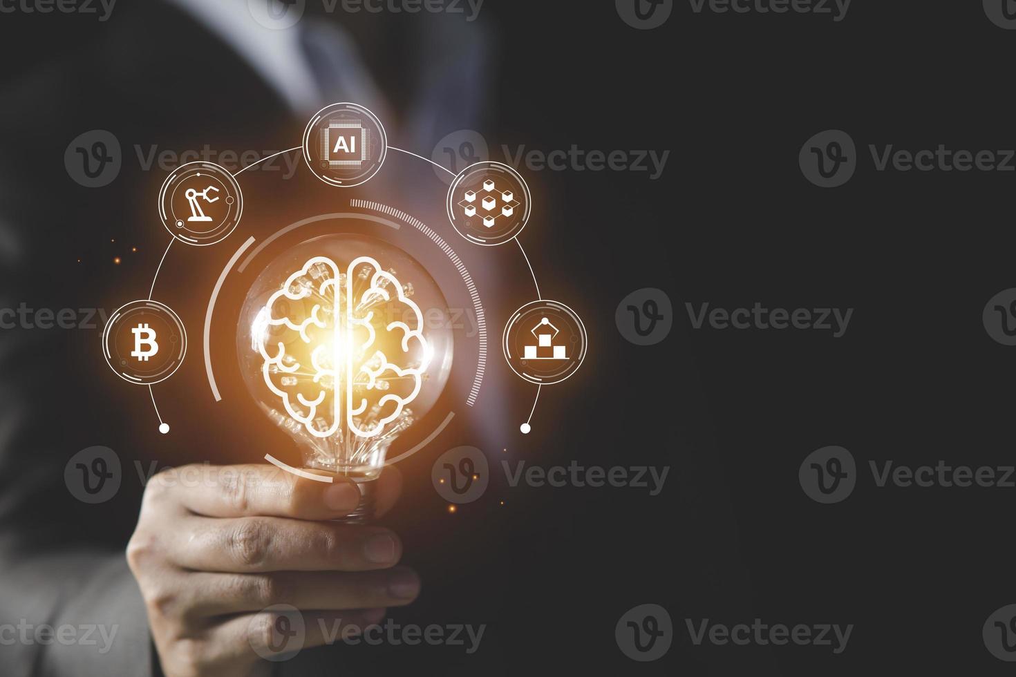 Businessman holding light bulb and brain icon inside, Futuristic businesss Ideas concept, Creative, inspiration, and innovation with network connection. Development innovative technology photo