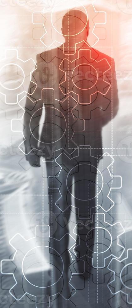 Vertical Panorama Banner. Double exposure gears mechanism on blurred background. Business and industrial process automation concept. photo