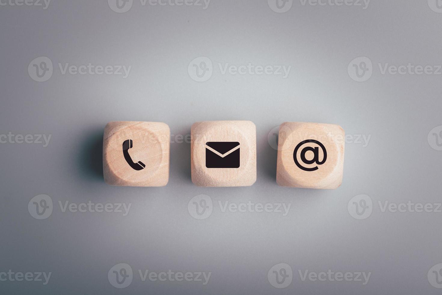 The wooden dice has a symbol. Contact us or the Customer support hotline people connect. photo