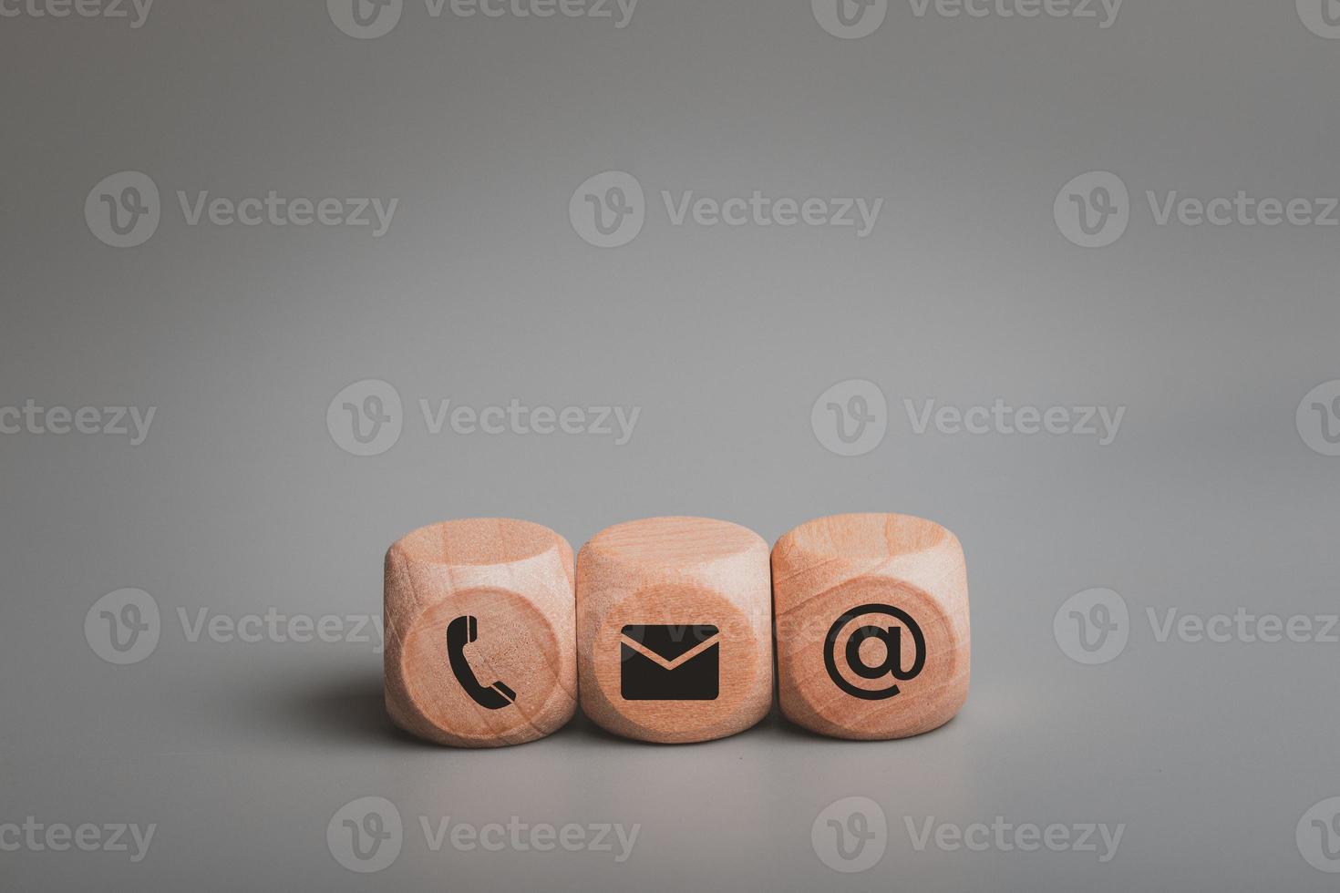 The wooden dice has a symbol. Contact us or the Customer support hotline people connect. photo