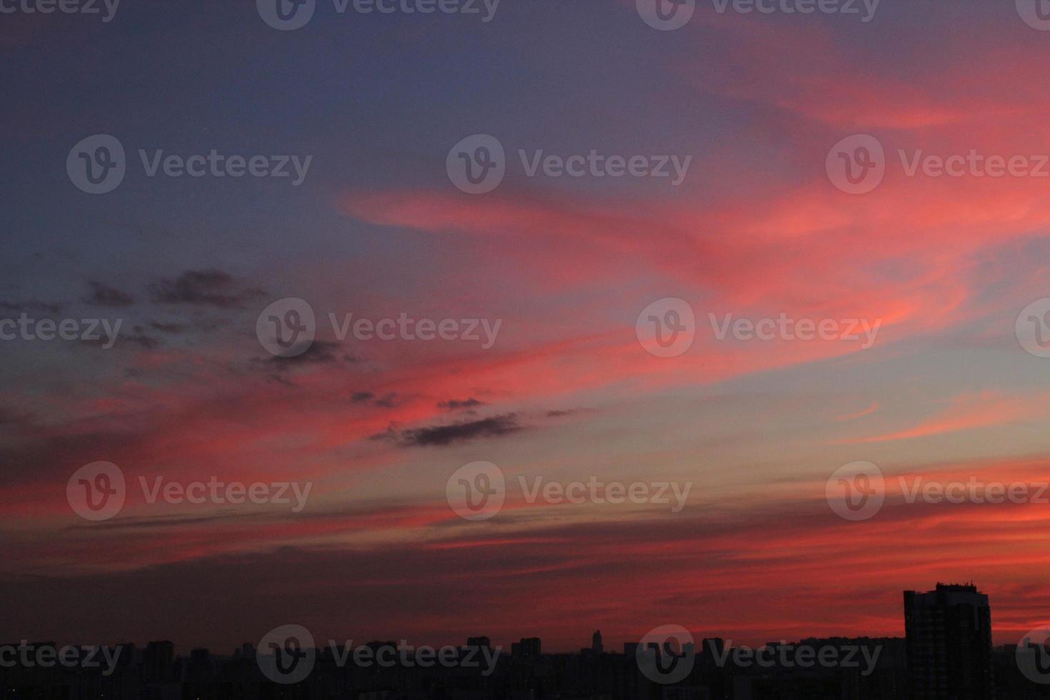 Colorful cloudy twilight beautiful sky cityscape sunset and morning sunrise. Dramatic evening night early morning view with city buildings silhouette. Panoramic background concept. Copy space for text photo