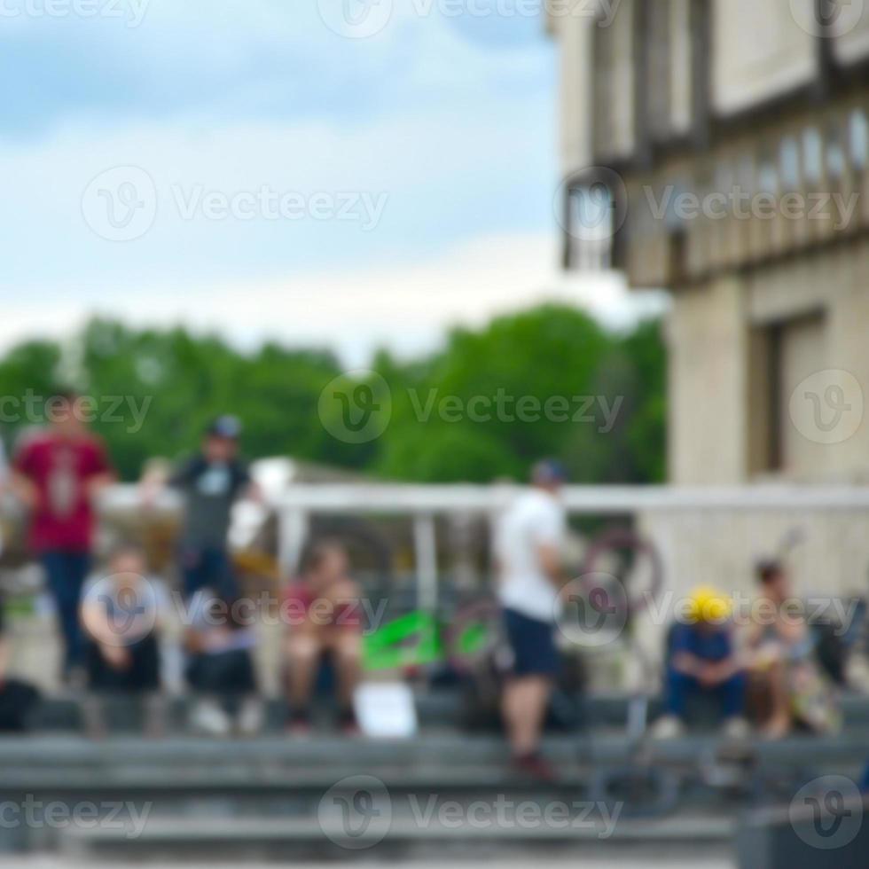 Defocused image of a lot of people with bmx bikes. Meeting of fans of extreme sports photo