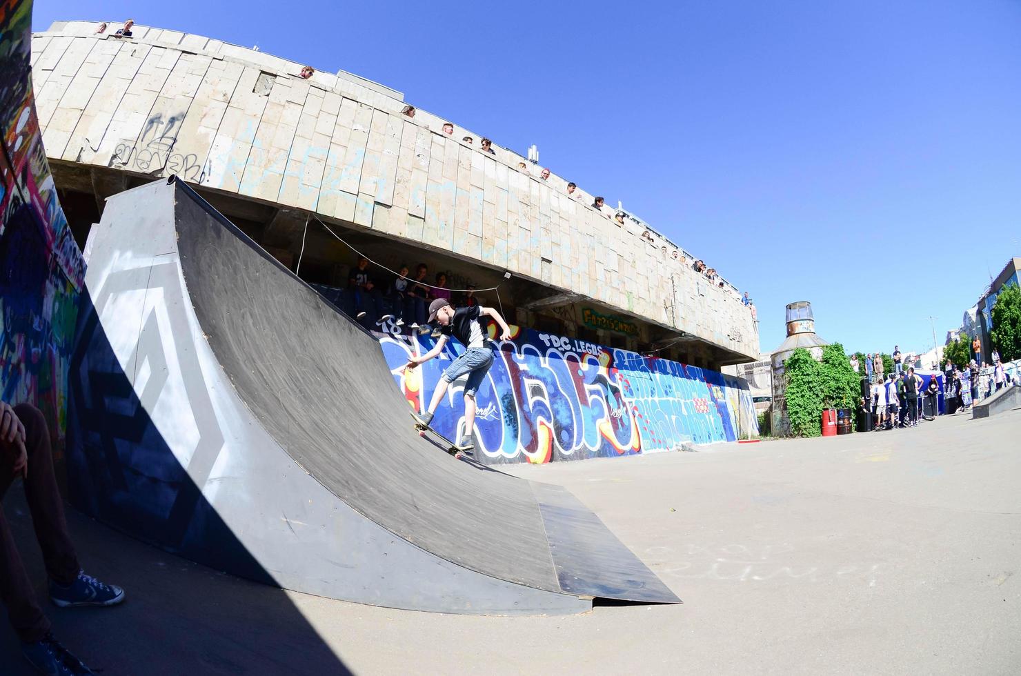 KHARKOV. UKRAINE - MAY 2, 2022 Skateboarding contest in outdoors skate park during the annual festival of street cultures photo