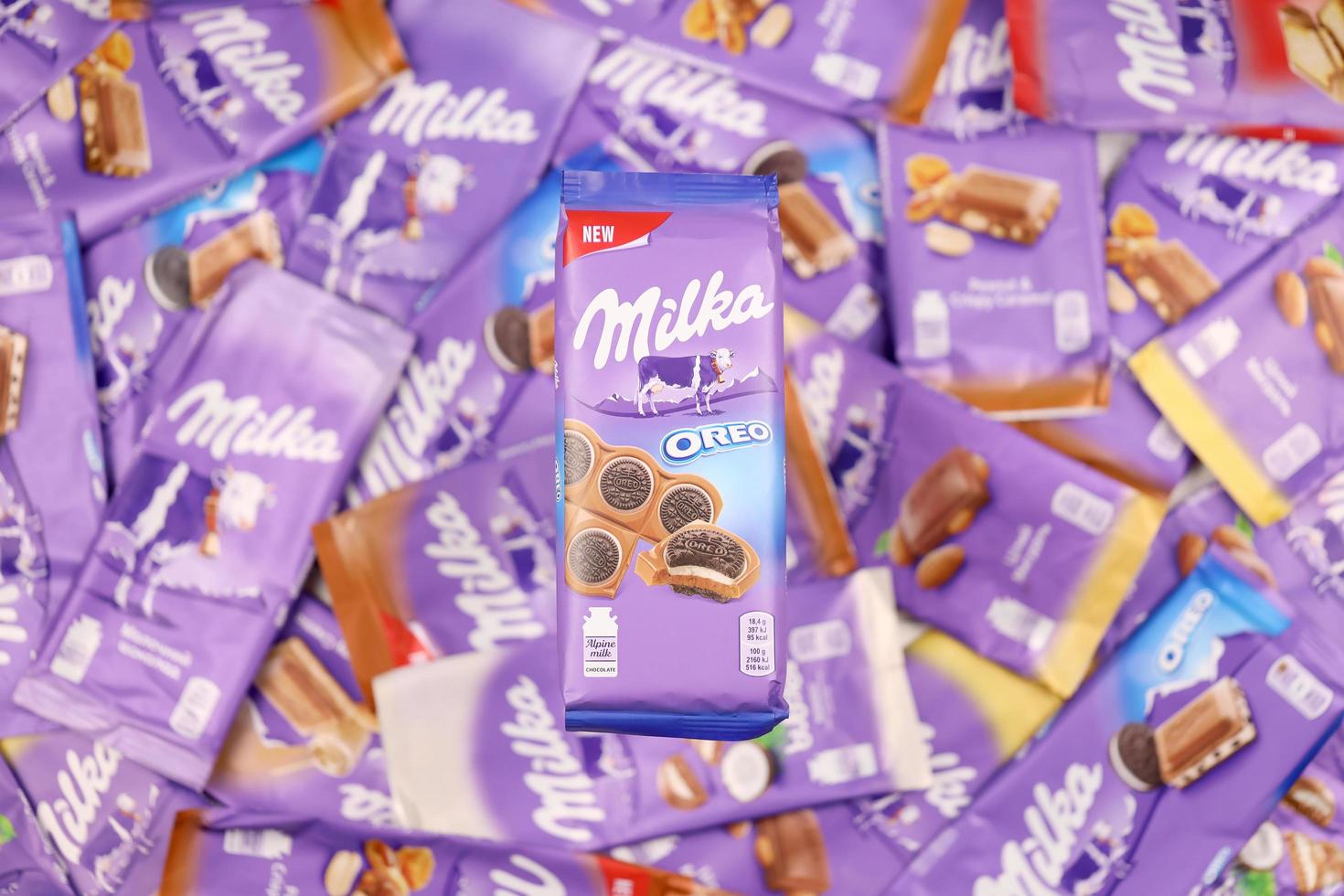 KHARKOV. UKRAINE - MAY 17, 2022 Many wrappings of purple Milka chocolate. Milka is a Swiss brand of chocolate confection manufactured by company Mondelez International photo