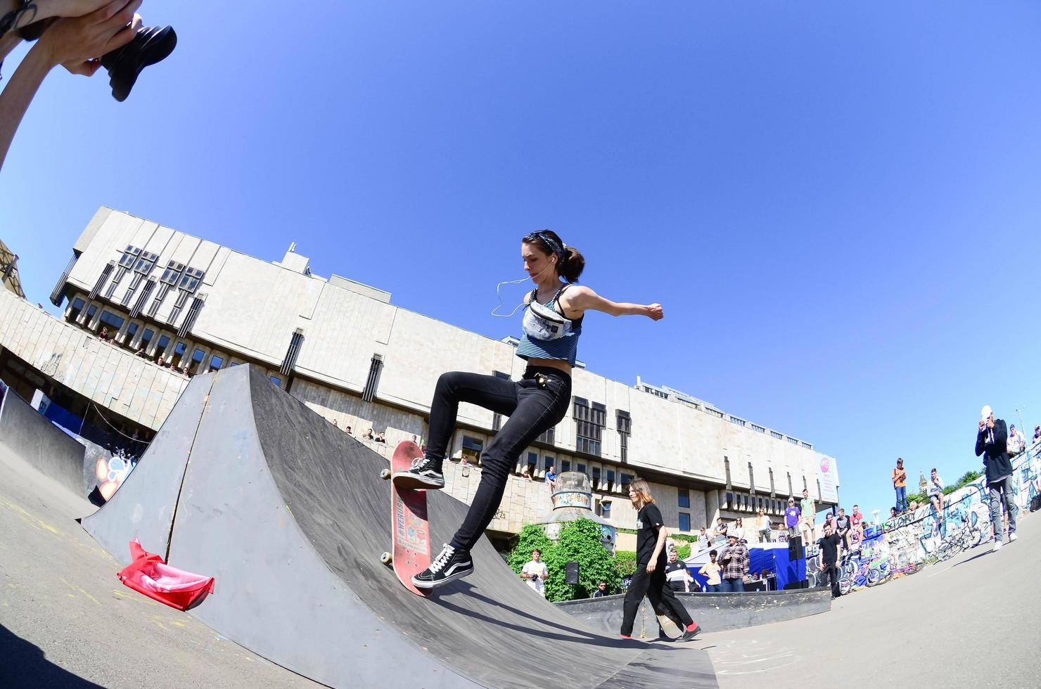 KHARKOV. UKRAINE - MAY 2, 2022 Skateboarding contest in outdoors skate park during the annual festival of street cultures photo