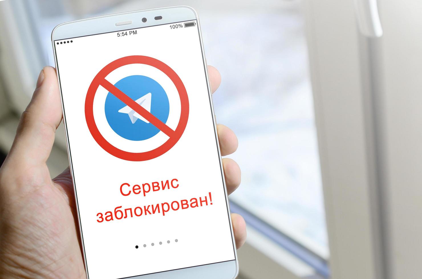 KHARKOV, UKRAINE - APRIL 27, 2022 A mobile phone with the Telegram app screen with a prohibiting sign and russian inscription Access is denied. Roskomnadzor blocked the Telegram service in Russia photo