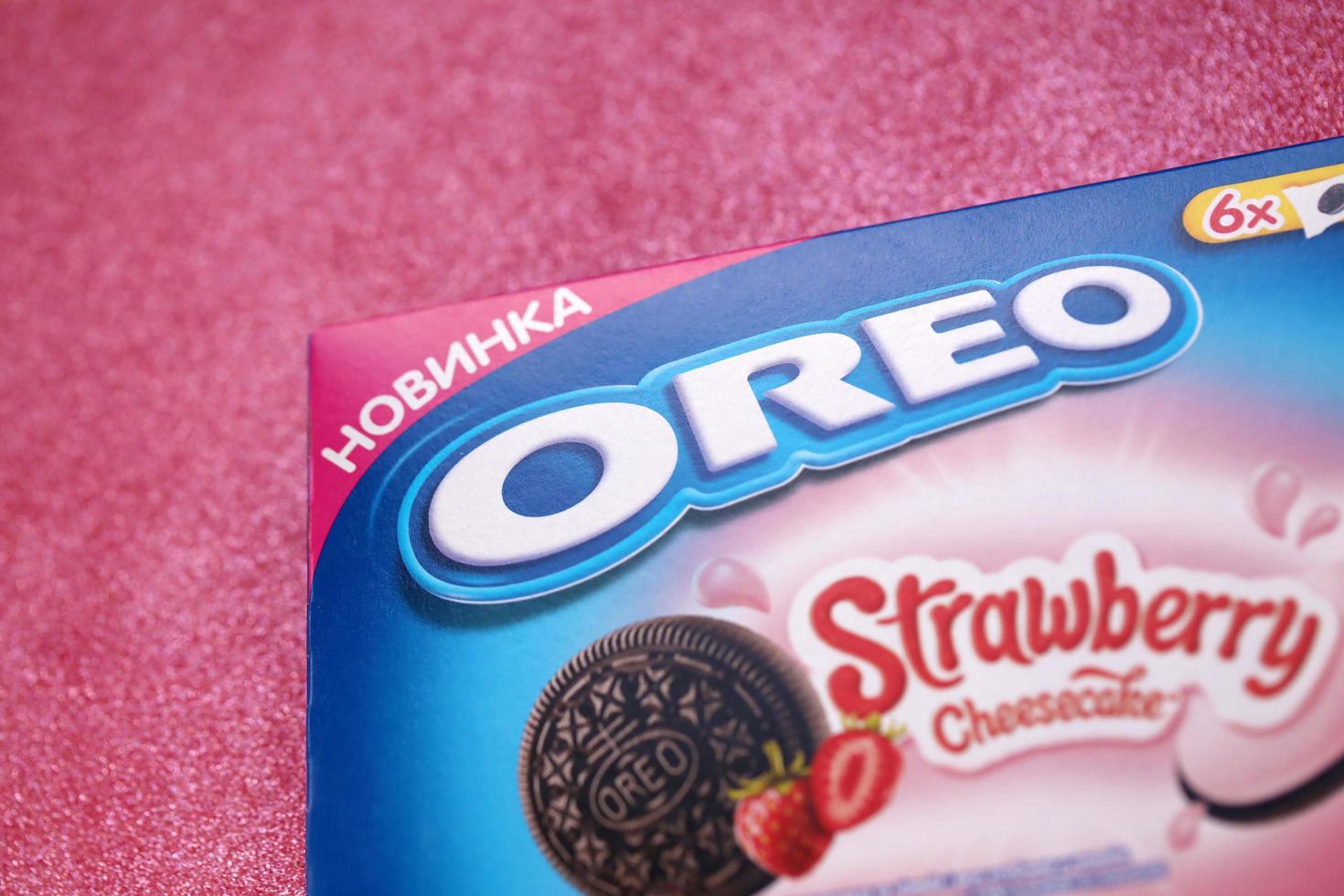 KHARKOV, UKRAINE - MAY 5, 2022 Oreo strawberry cheesecake crispy cookie box. The brand Oreo is owned by company Mondelez international photo