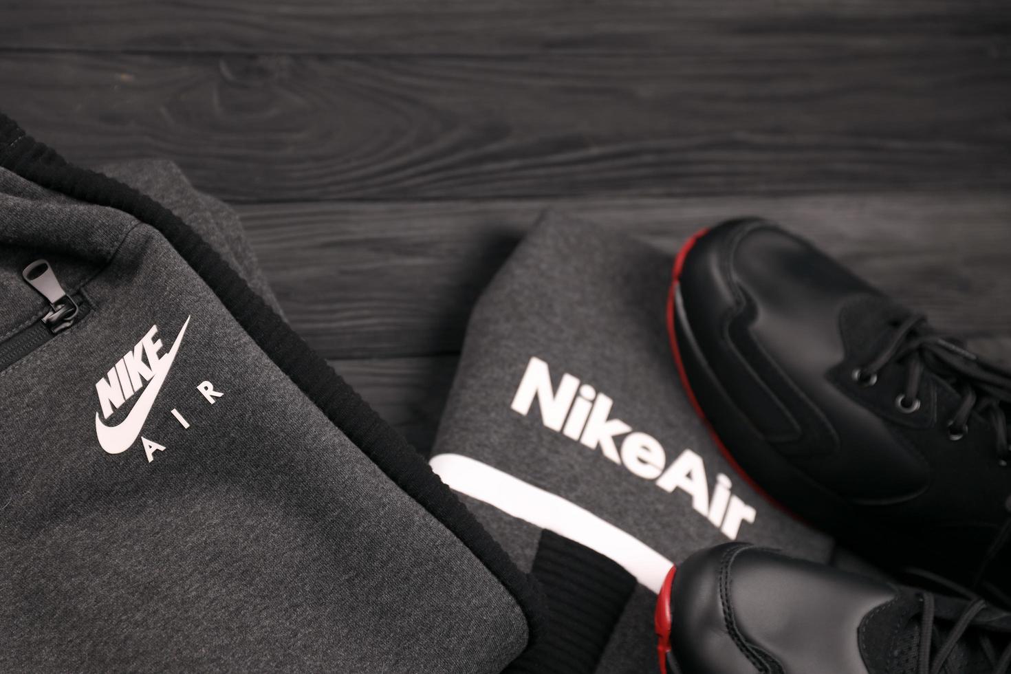 KHARKOV, UKRAINE - DECEMBER 20, 2022 Nike brand clothes and shoes sport wear kit. Nike is American multinational corporation engaged in manufacturing and worldwide marketing of clothes and footwear photo