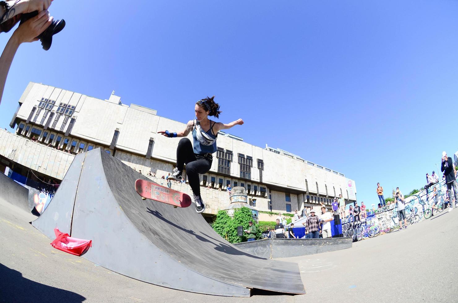 KHARKOV. UKRAINE - MAY 2, 2022 Skateboarding contest in outdoors skate park during the annual festival of street cultures photo